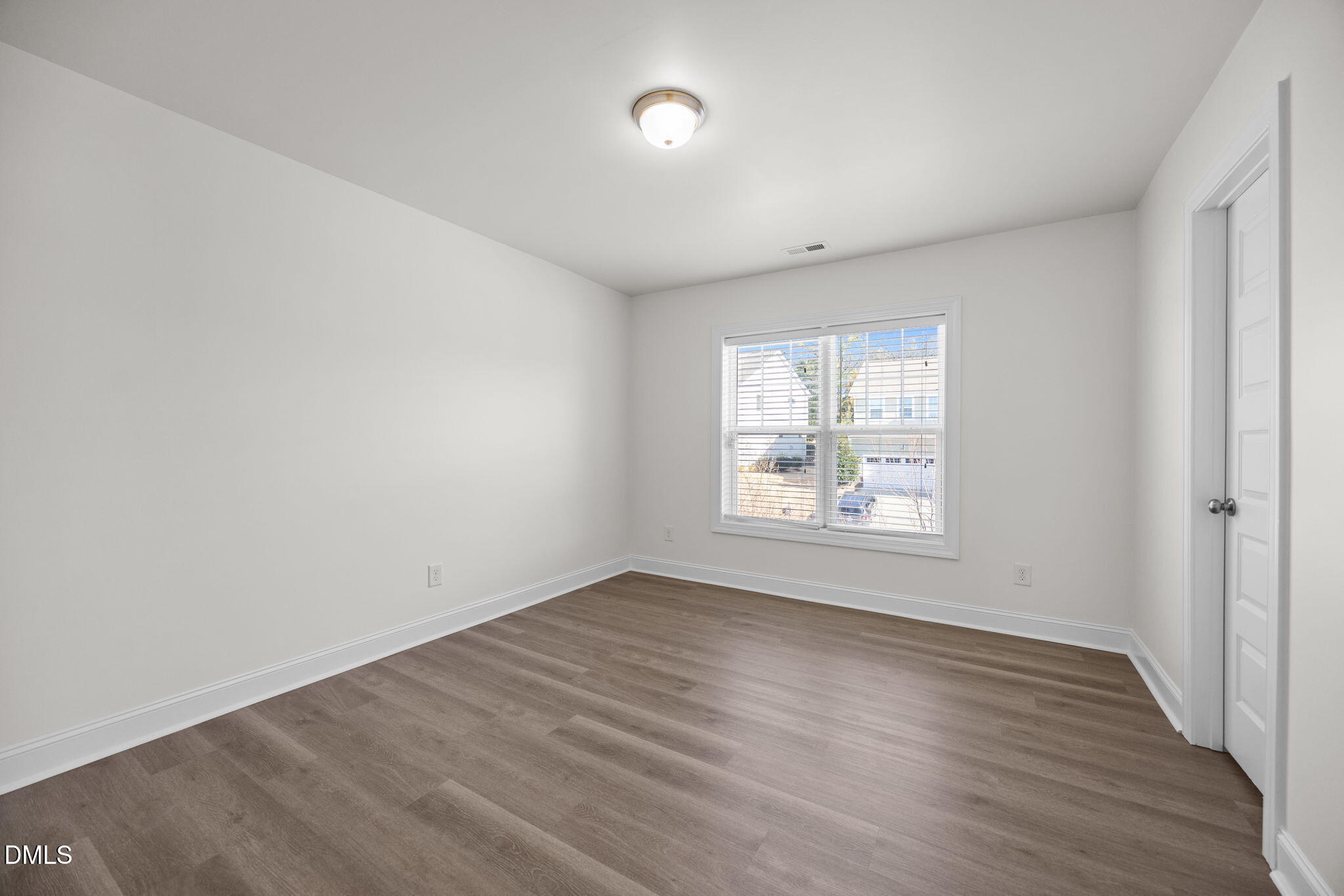 336 Plott Hound Lane Wake Forest, NC 27587 - Photo 25 of 39 an empty room with wooden floor and windows