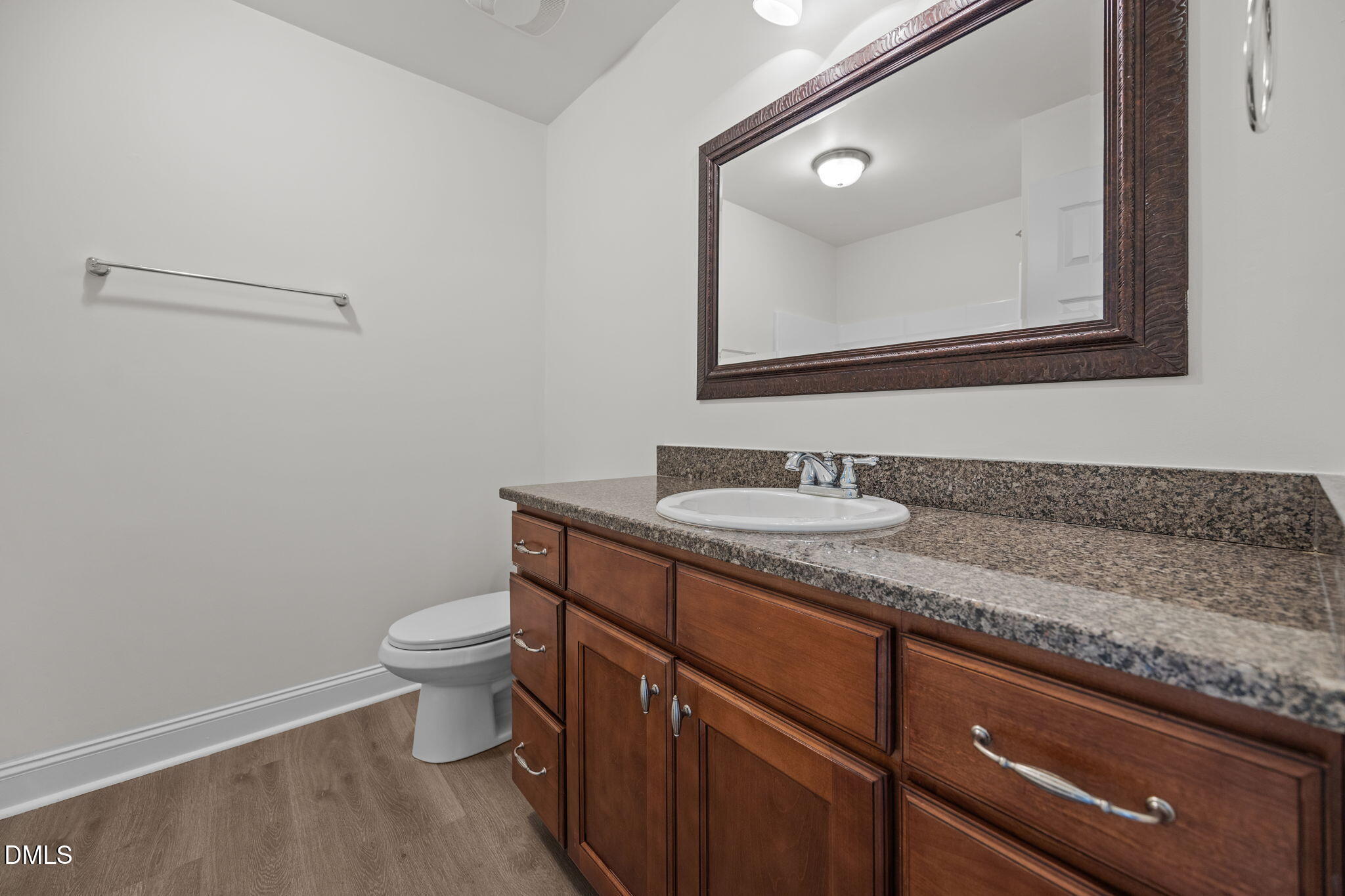 336 Plott Hound Lane Wake Forest, NC 27587 - Photo 28 of 39 a bathroom with a granite countertop sink a toilet and a mirror
