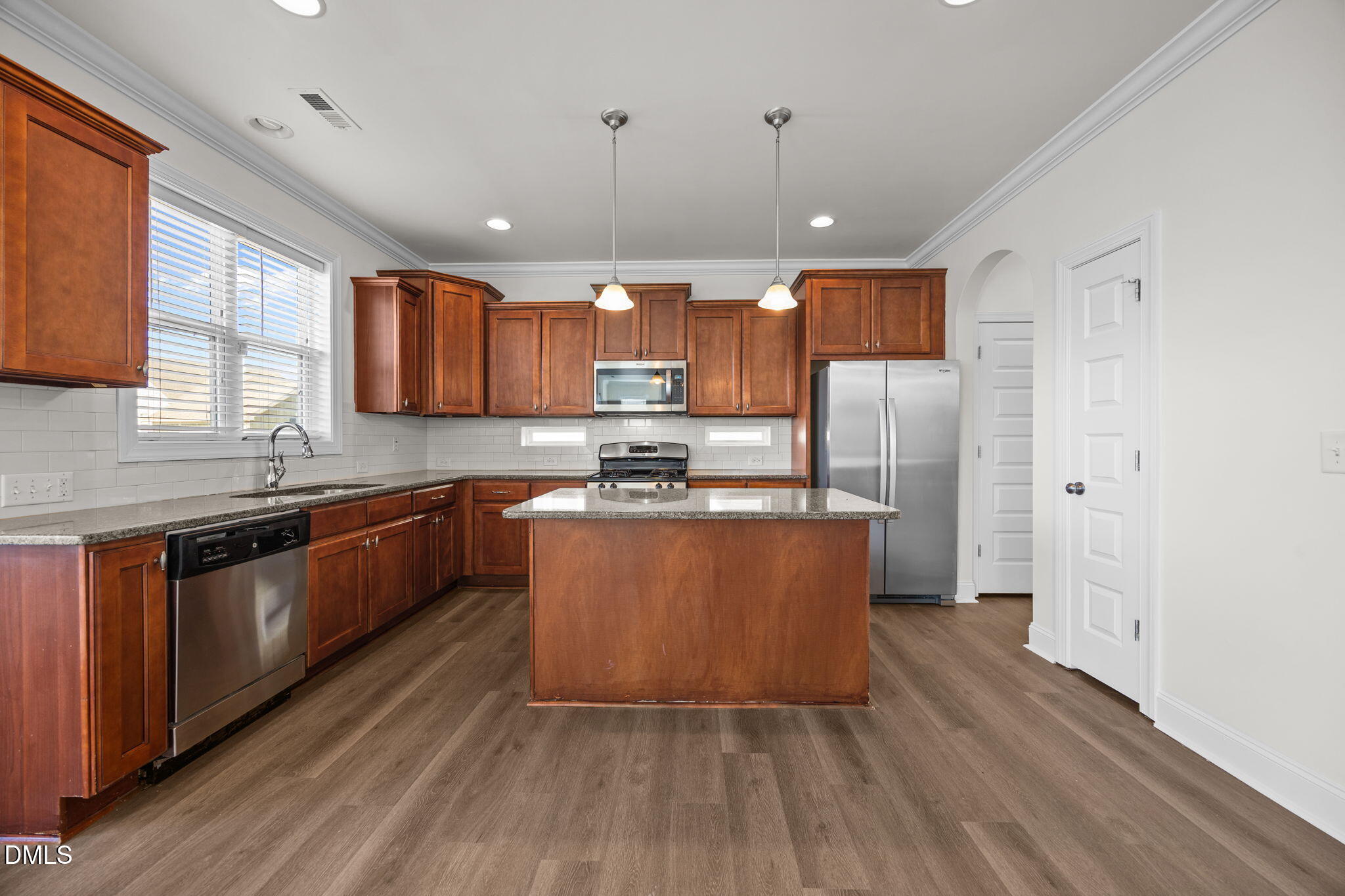 336 Plott Hound Lane Wake Forest, NC 27587 - Photo 10 of 39 a large kitchen with stainless steel appliances granite countertop a stove a sink dishwasher and a refrigerator