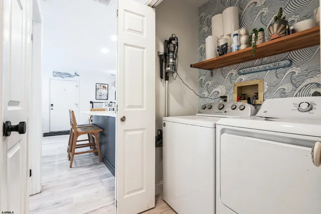 a view of living room with furniture and fireplace