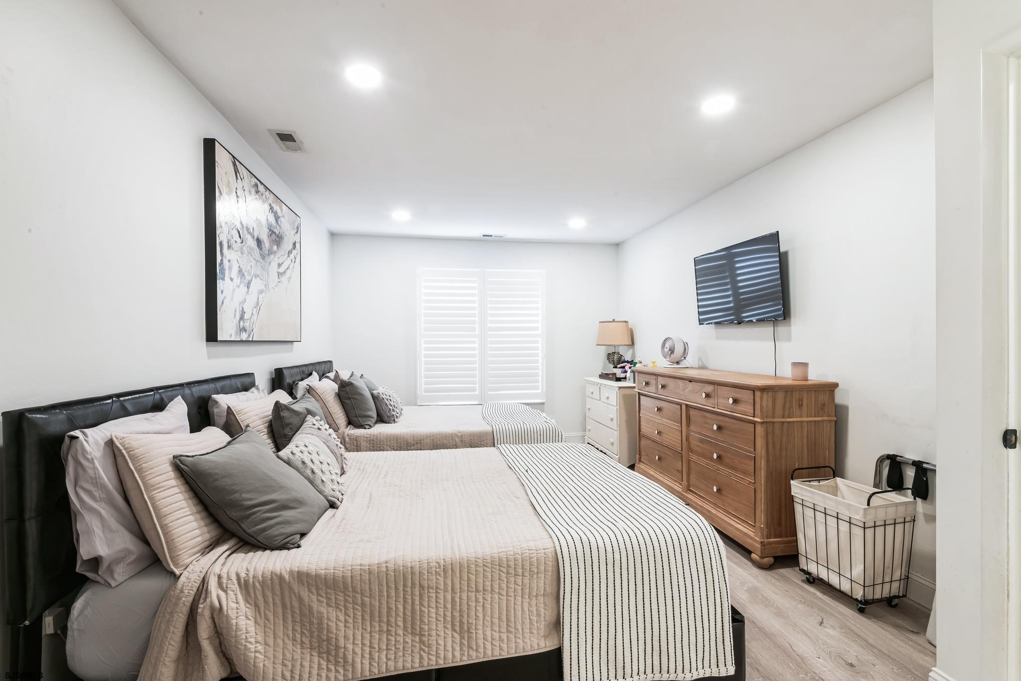 308 Harbour Cove, Unit 308 Somers Point, NJ 08244 - Photo 12 of 16 a bedroom with a bed and furniture