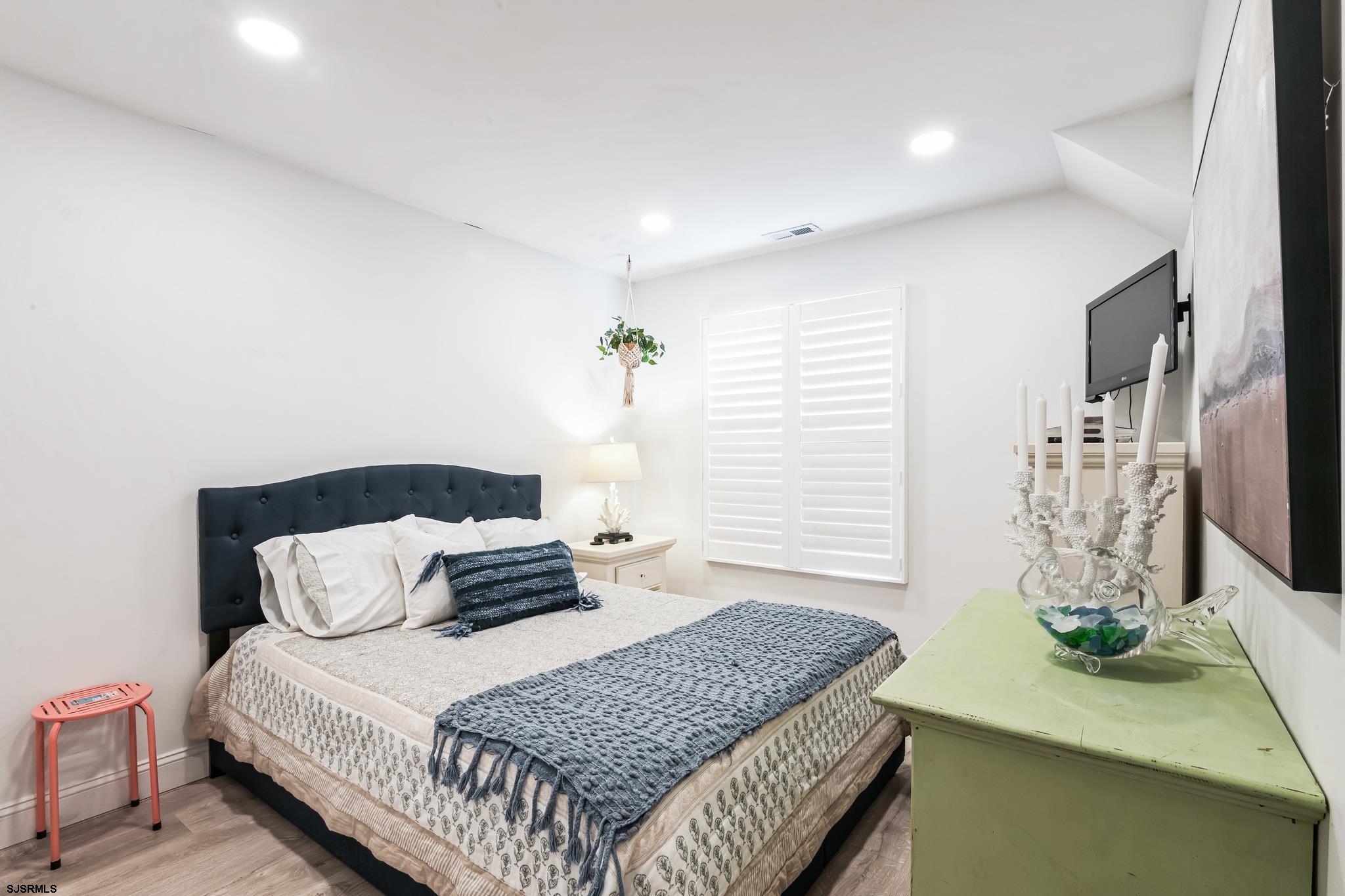 308 Harbour Cove, Unit 308 Somers Point, NJ 08244 - Photo 13 of 16 a bedroom with a bed and window