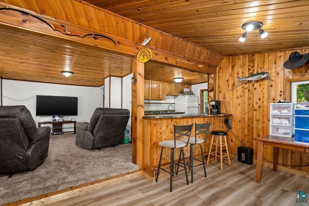 5466 Jean Duluth Road Duluth, MN 55803 - Photo 4 of 34 Wood-paneled ceilings and walls complement wood-finish flooring