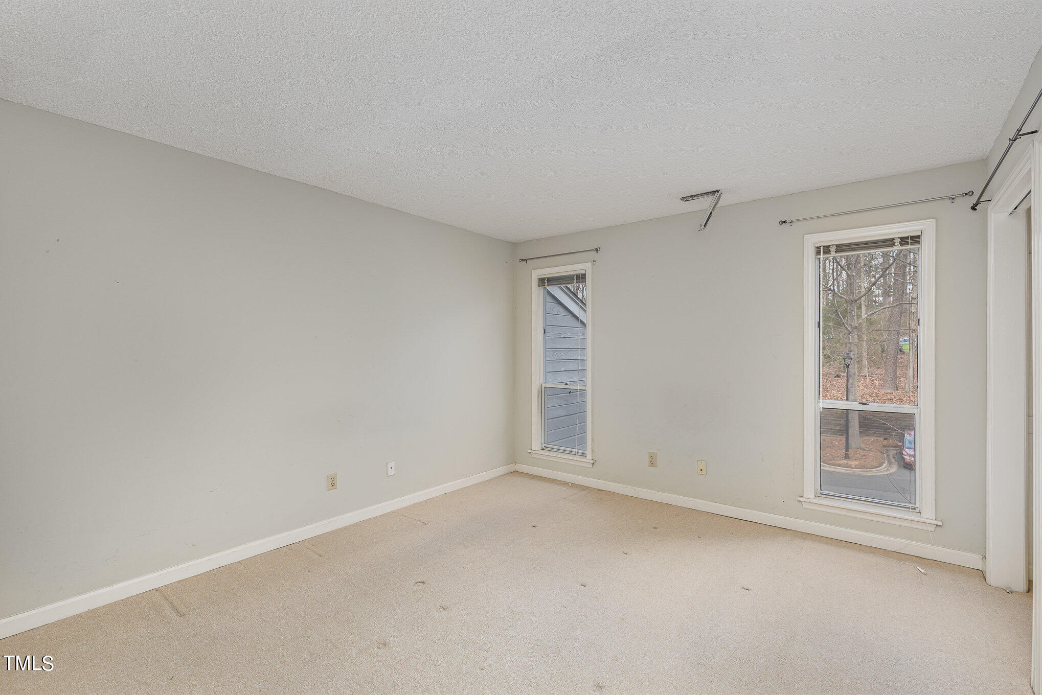 4631 Timbermill Court, Unit 303 Raleigh, NC 27612 - Photo 11 of 15 an empty room with windows