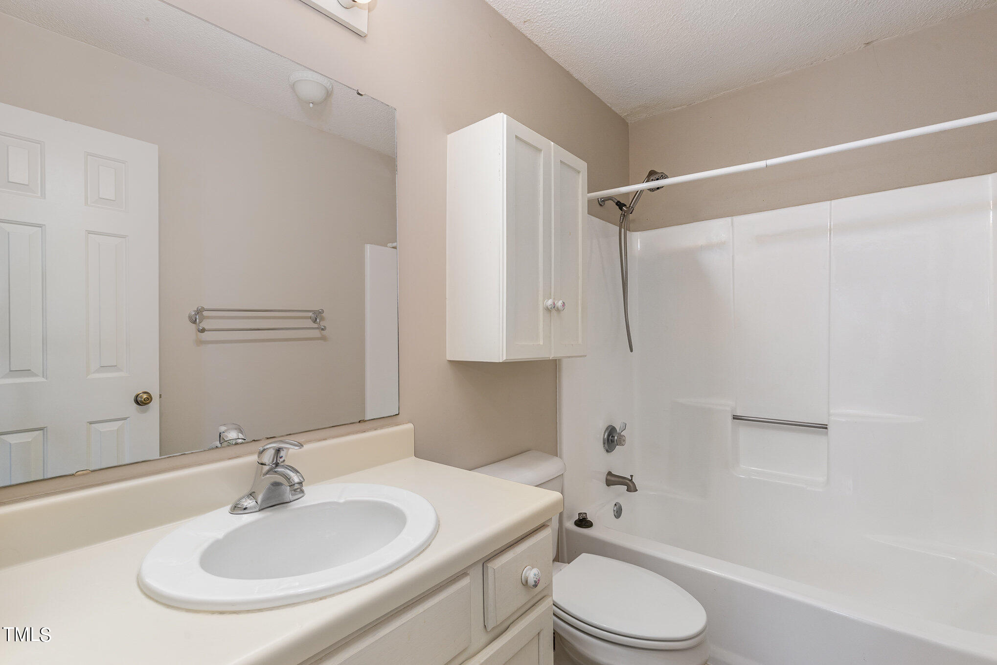 4631 Timbermill Court, Unit 303 Raleigh, NC 27612 - Photo 15 of 15 a bathroom with a sink toilet and shower