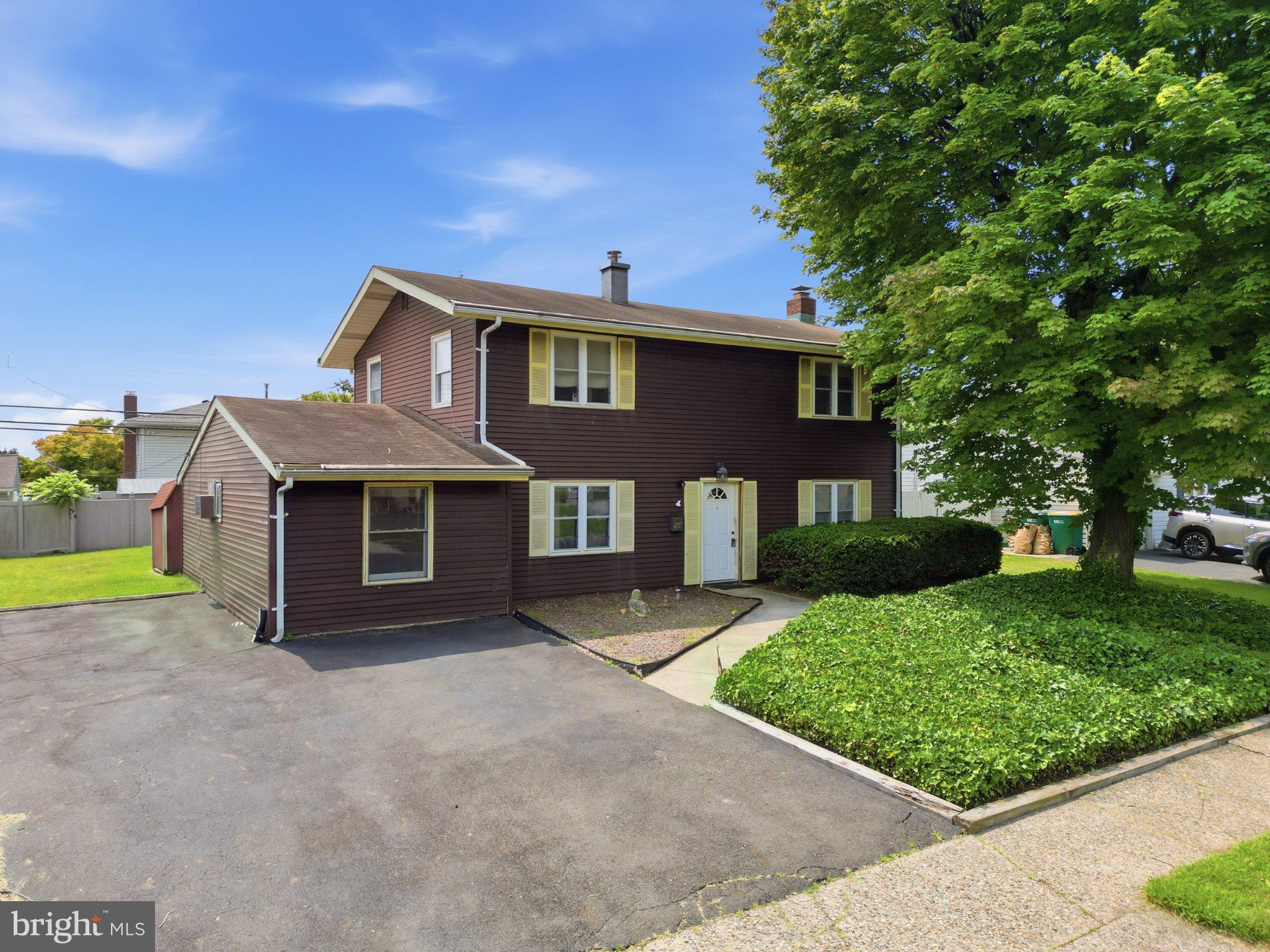 94 Terrace Road Levittown, PA 19056 - Photo 5 of 70 Charming two-story home with lush greenery.