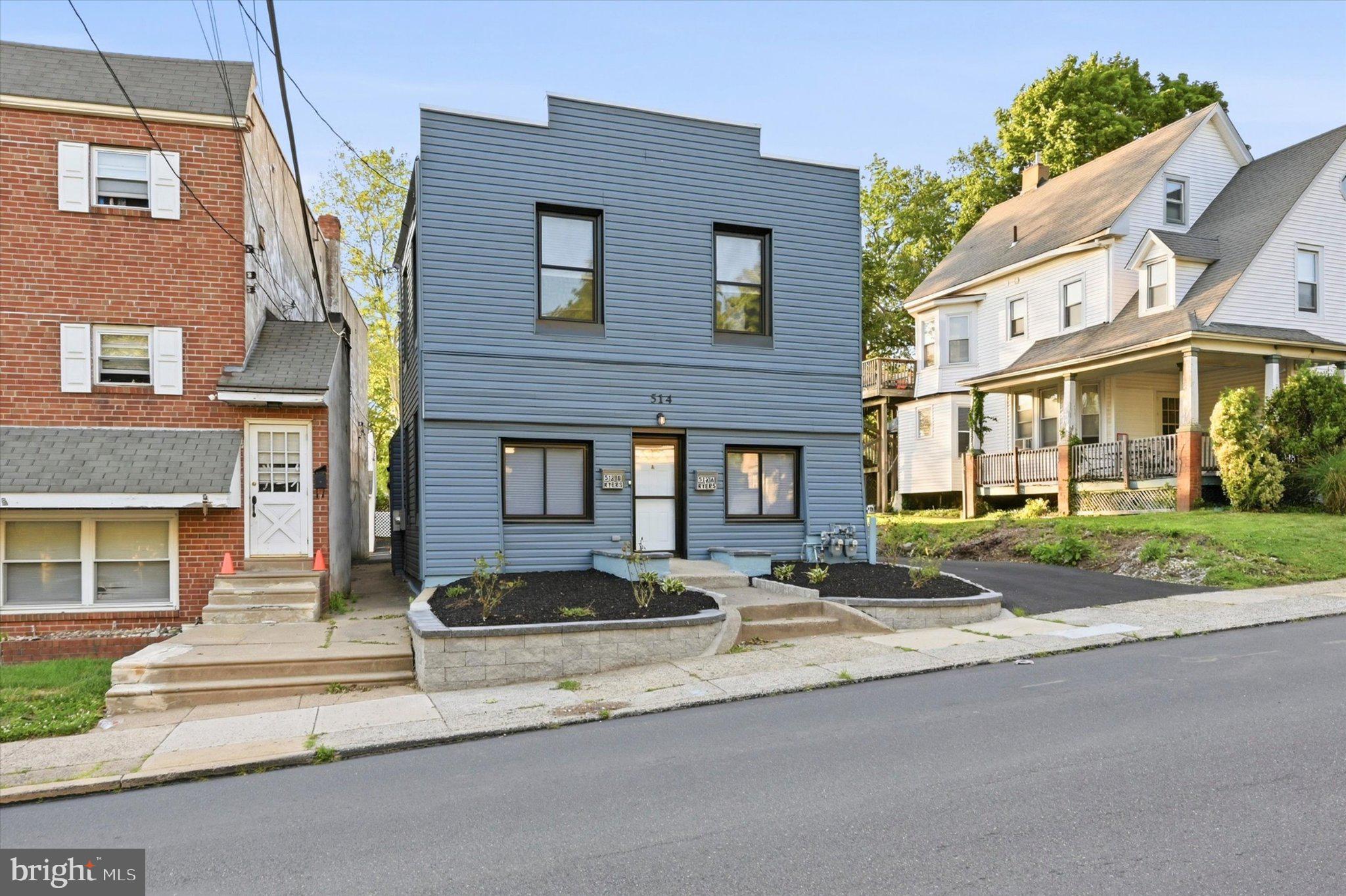 Charming blue duplex in a serene setting.