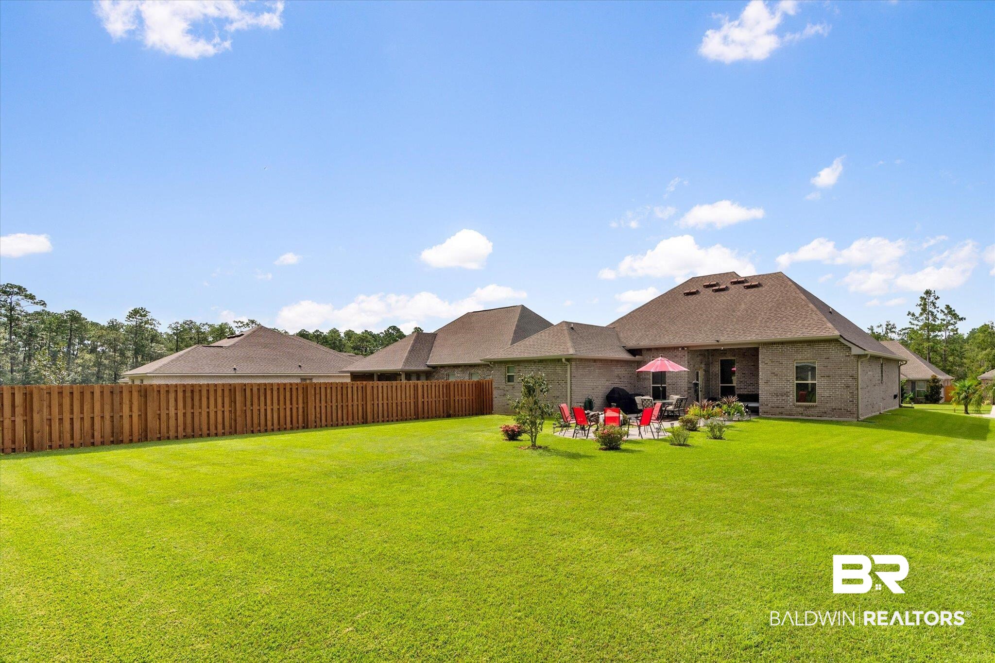 1786 Vivace Drive Foley, AL 36535 - Photo 19 of 21 Rear view of property with brick siding and a patio