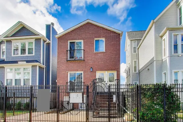 a front view of a house with glass windows