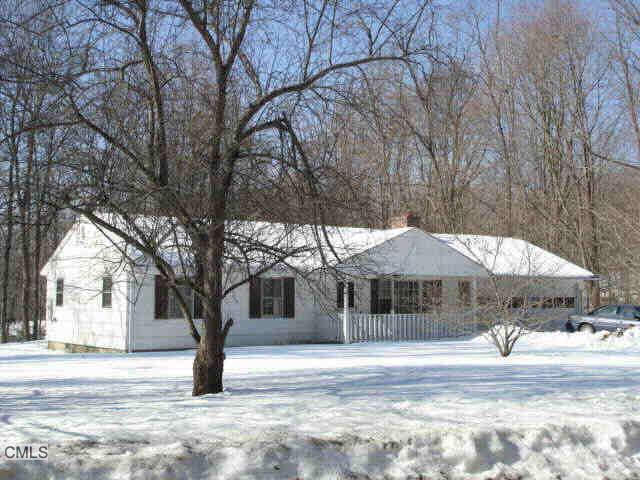12 Deer Hill Road Redding, CT 06896 - Photo 1 of 1 a house with trees in front of it