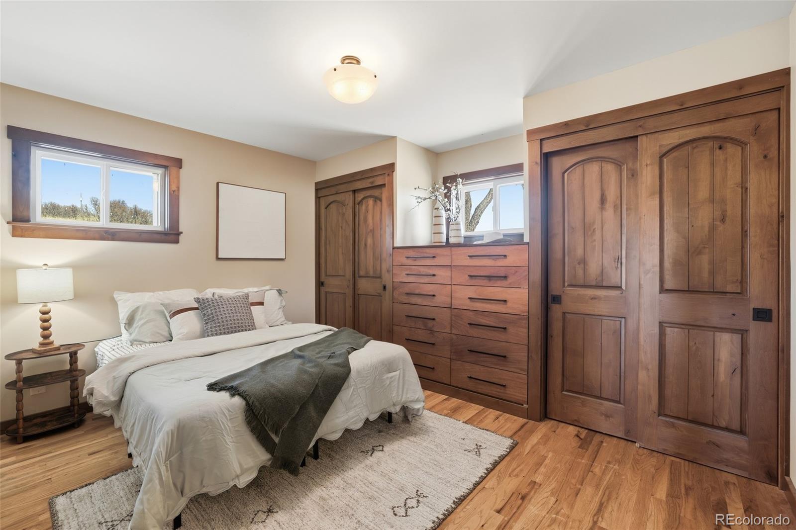 2097 West Wolfensberger Road Castle Rock, CO 80109 - Photo 20 of 48 a bedroom with a bed and a dresser