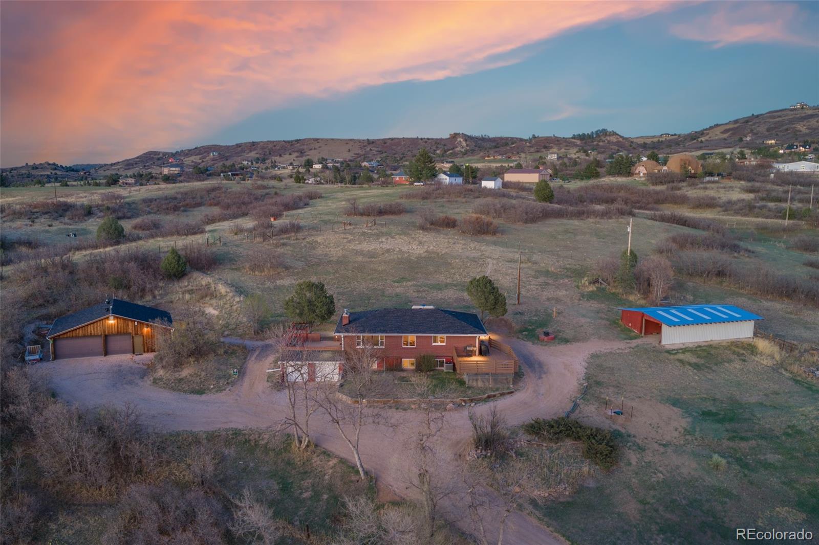 2097 West Wolfensberger Road Castle Rock, CO 80109 - Photo 3 of 48 an aerial view of a house with a yard
