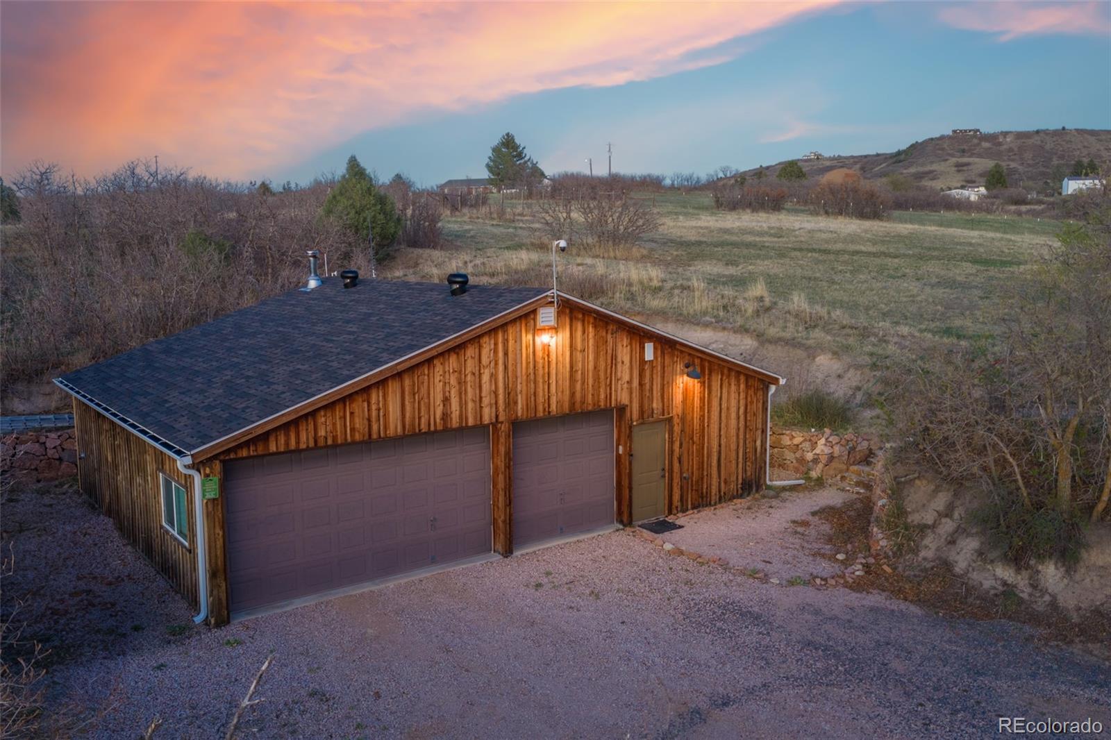 2097 West Wolfensberger Road Castle Rock, CO 80109 - Photo 4 of 48 a backyard of a house with lots of green space