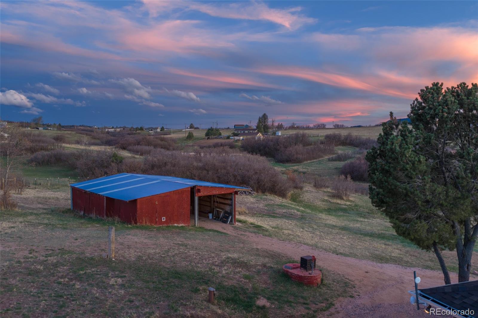 2097 West Wolfensberger Road Castle Rock, CO 80109 - Photo 5 of 48 an aerial view of a house with a yard