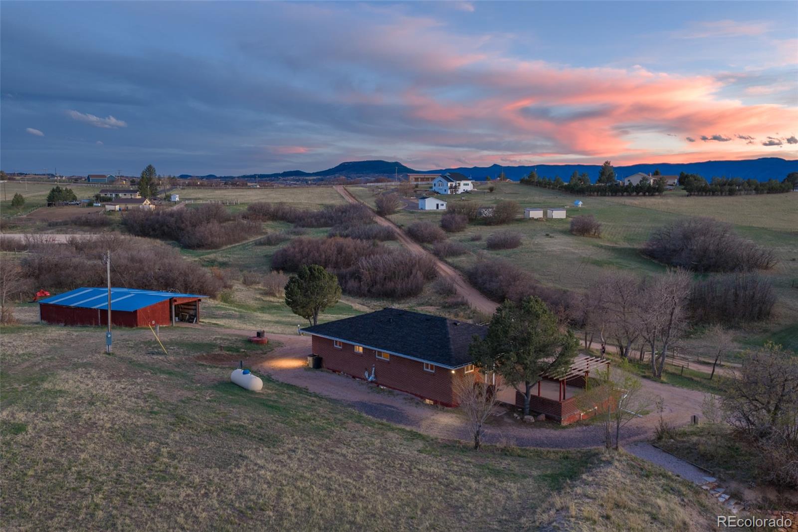 2097 West Wolfensberger Road Castle Rock, CO 80109 - Photo 6 of 48 a view of a backyard with table and chairs