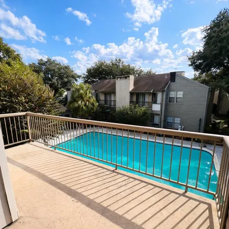 a balcony with wooden floor