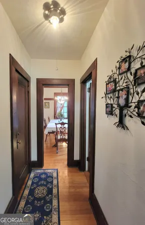 a bedroom with furniture and a chandelier