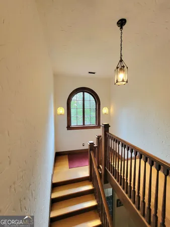 a spacious bedroom with a bed and a table in it