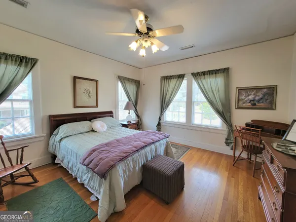 a bathroom with a sink mirror and window