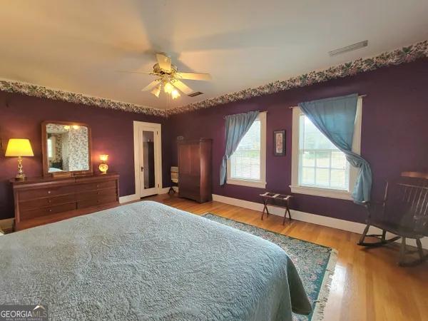 a view of a room with window and furniture