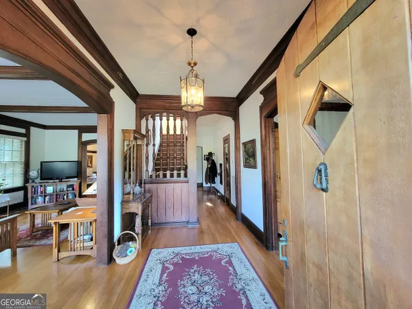 a view of a hallway view with living room and dining room