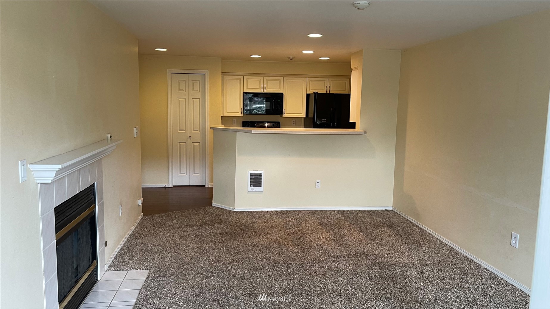 23908 Bothell Everett Highway, Unit B103 Bothell, WA 98021 - Photo 8 of 15 a view of kitchen with kitchen island wooden floor and electronic appliances