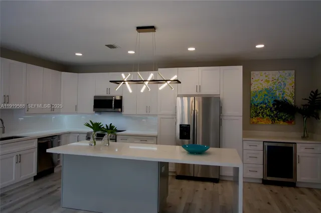 a picture of a hallway with a potted plant