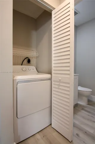 a bathroom with a sink toilet and mirror