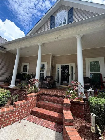 a front view of a house with outdoor seating