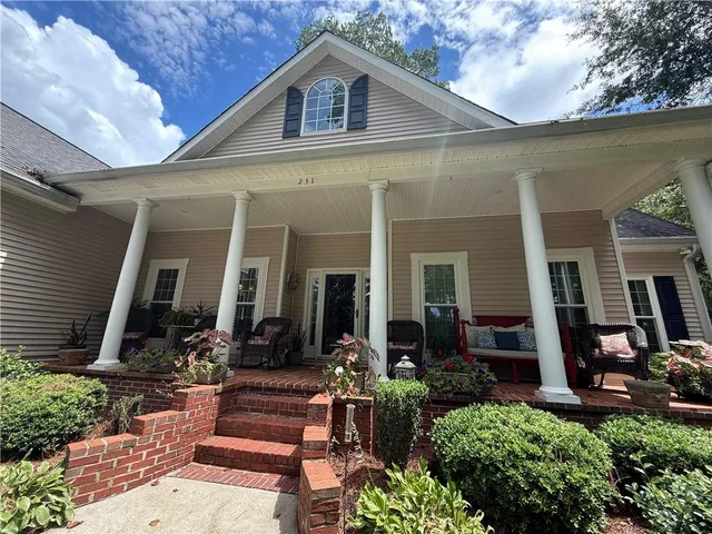a front view of a house with patio