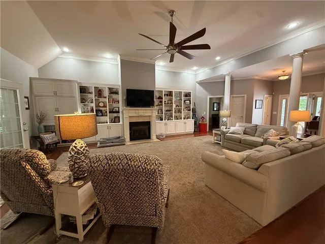 a living room with furniture and a fireplace