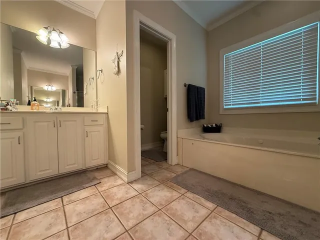 a bathroom with a sink a mirror and a bathtub