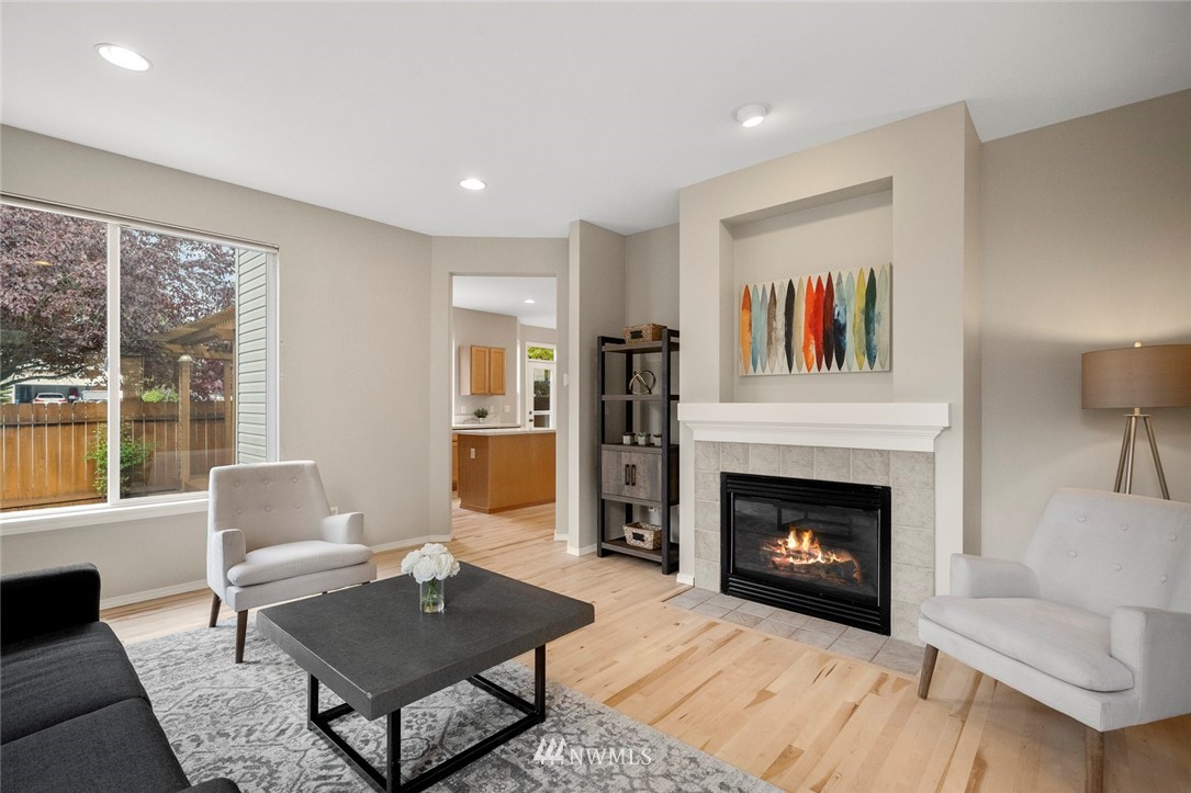 4918 Northeast 4th Place Renton, WA 98059 - Photo 3 of 33 a living room with furniture and a fireplace