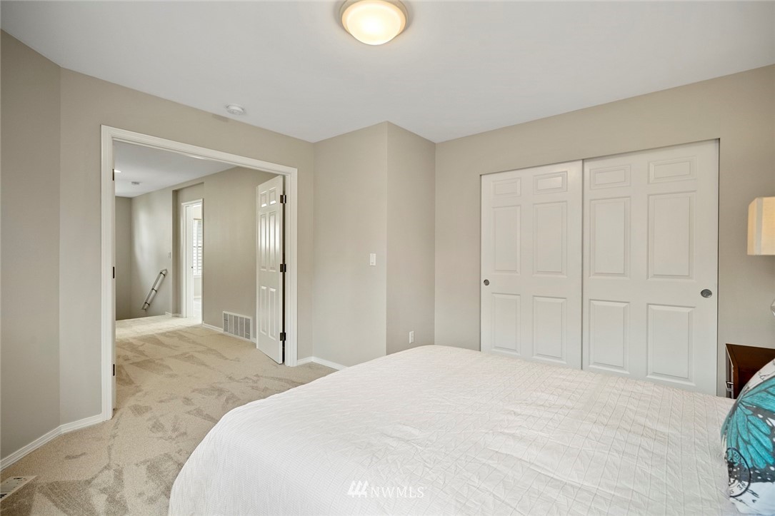 4918 Northeast 4th Place Renton, WA 98059 - Photo 22 of 33 a bedroom with a bed and closet