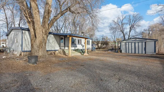 a view of outdoor space with deck and tree