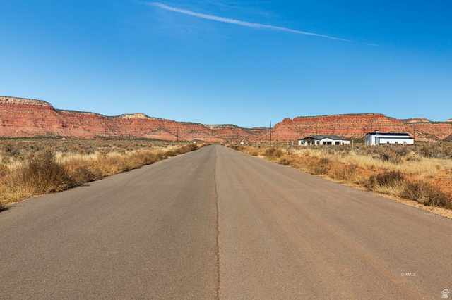 11 Crimson Road East, Unit 11 Kanab, UT 84741 - Photo 2 of 21 View of asphalt street featuring a mountain view