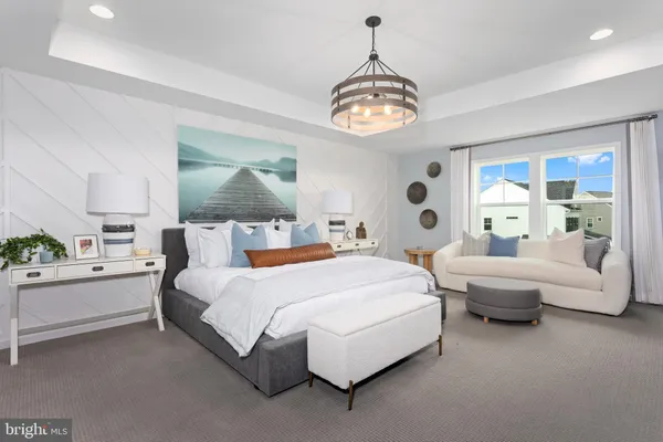 a spacious bedroom with a bed and a large window