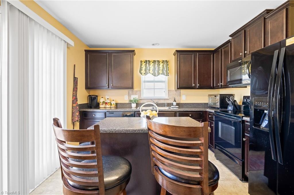 508 Carter Ridge Drive Reidsville, NC 27320 - Photo 9 of 39 Kitchen Island, 2 Bar Stools to remain!