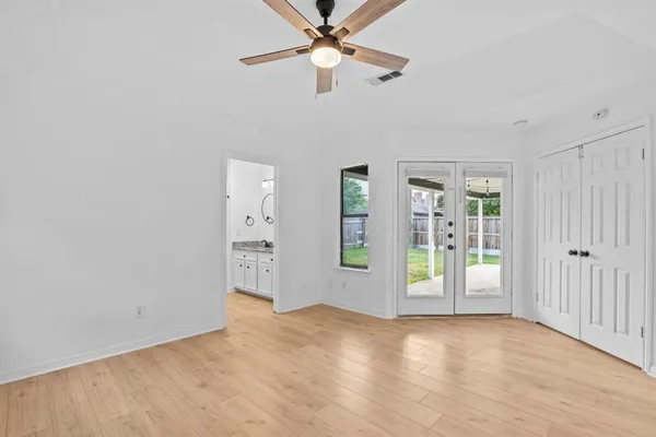 a view of an empty room with a window