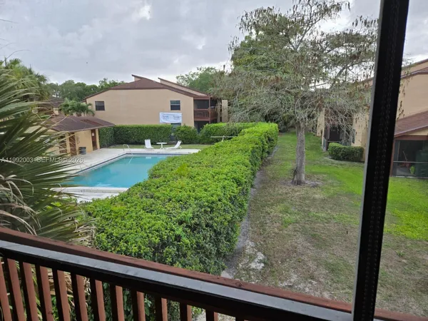 a view of a garden from a balcony