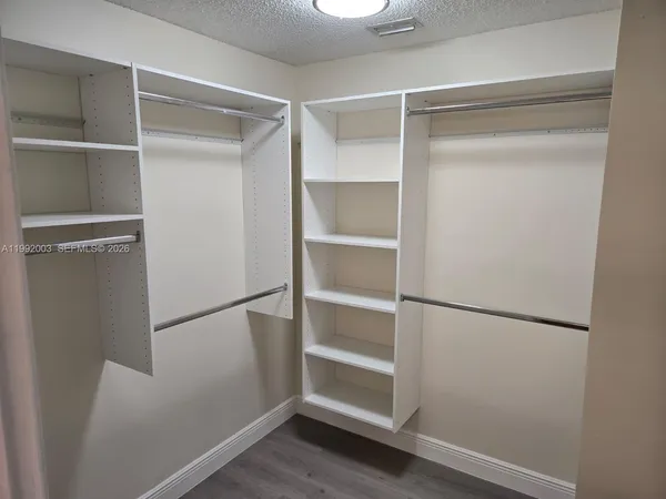 a view of an empty walk in closet