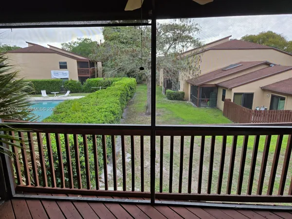 a view of a porch with a yard