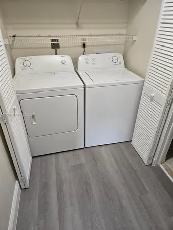 a utility room with dryer and washer