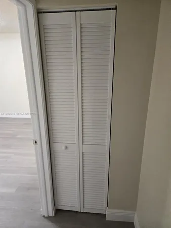 a view of front door with wooden floor