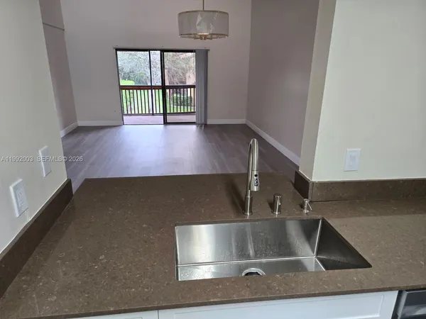 a view of kitchen and sink