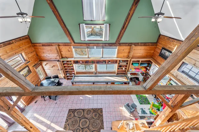 a view of a hall with wooden floor