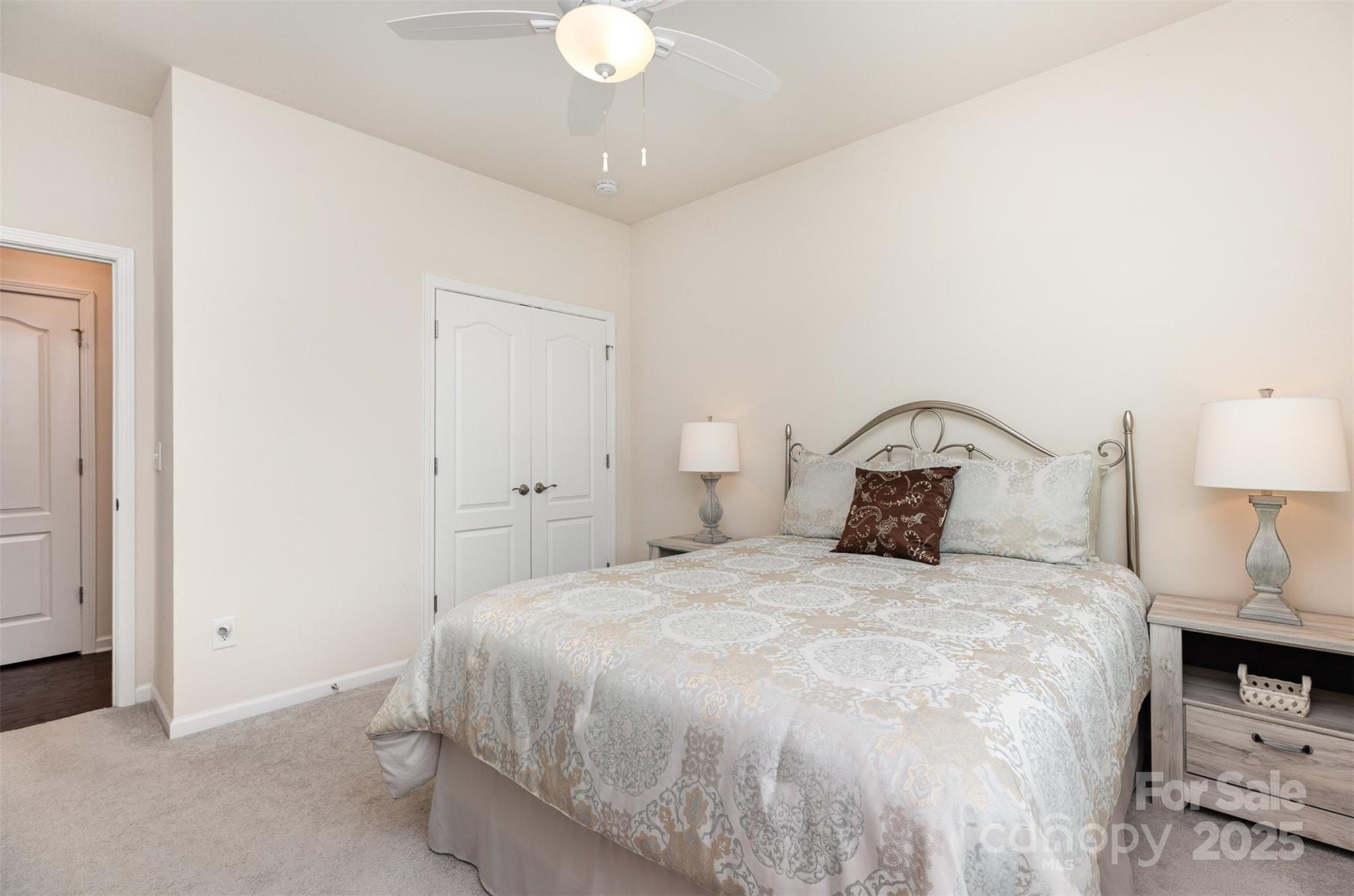 1663 Tranquility Boulevard Lancaster, SC 29720 - Photo 19 of 42 a bedroom with a bed and a lamp on dresser
