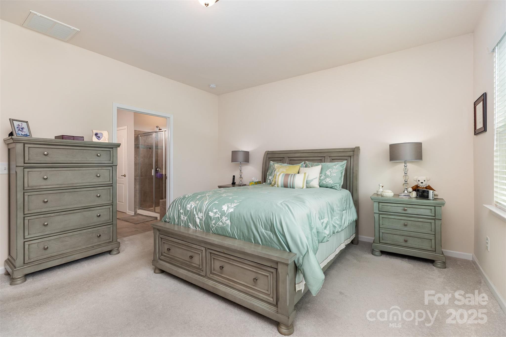 1663 Tranquility Boulevard Lancaster, SC 29720 - Photo 23 of 42 a spacious bedroom with a bed and a dresser