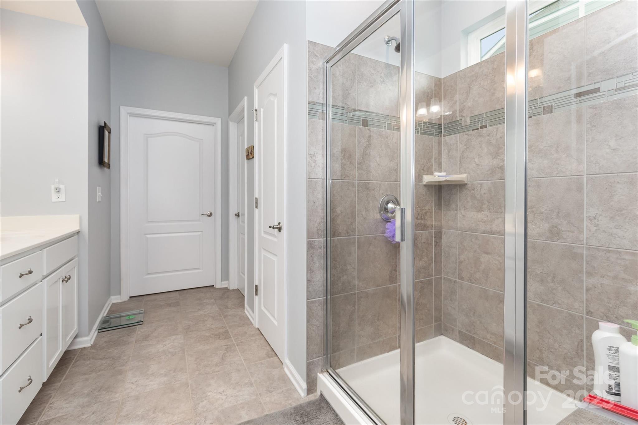 1663 Tranquility Boulevard Lancaster, SC 29720 - Photo 24 of 42 a bathroom with a shower and a sink
