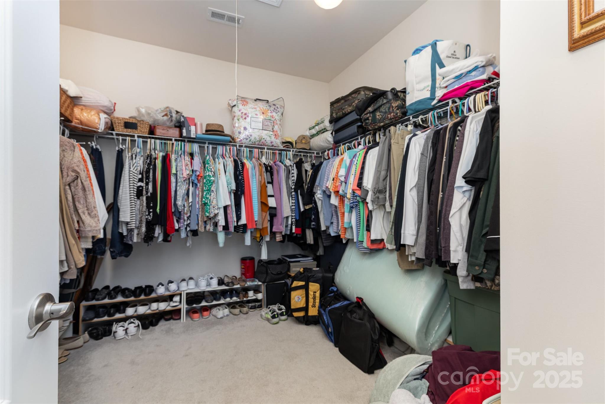 1663 Tranquility Boulevard Lancaster, SC 29720 - Photo 26 of 42 a view of walk in closet with clothes and shoes